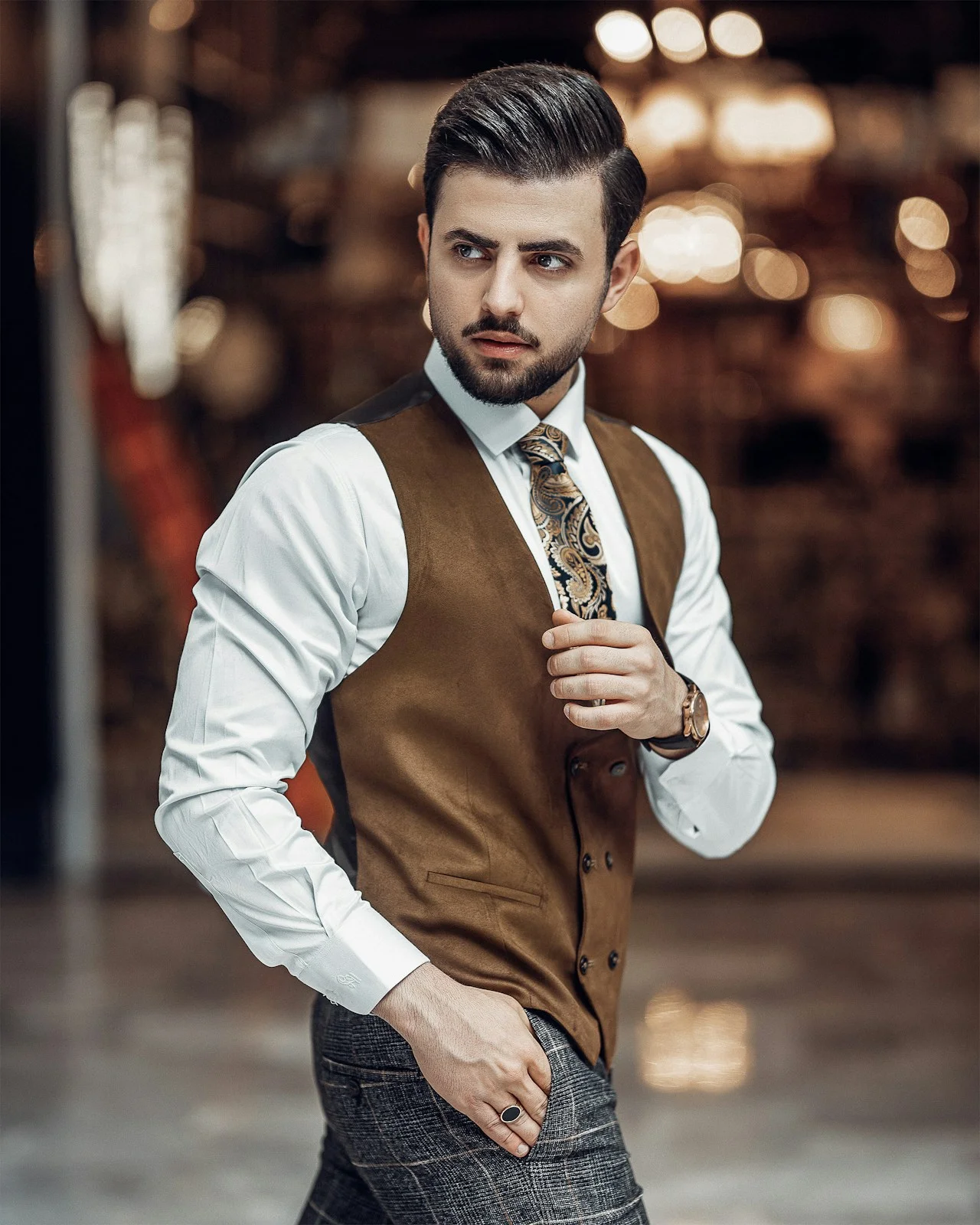 Copper-toned button-front waistcoat, styled over a white shirt and tie.
