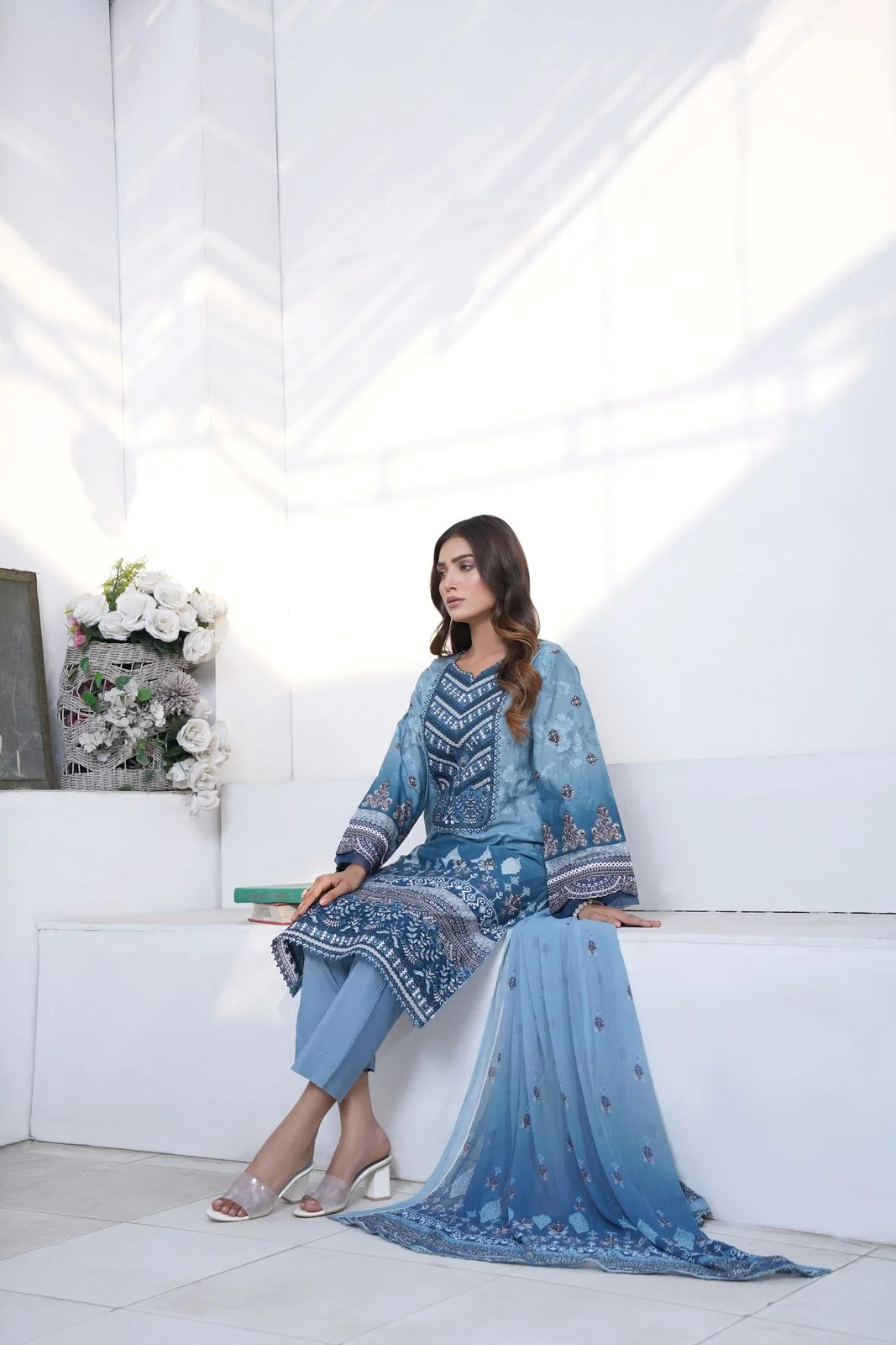 Blue kurta, trousers and draped dupatta shown together in a light studio.